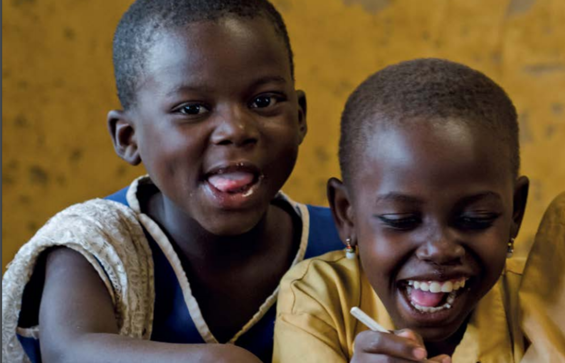 Two smiling primary-school children in Kenya